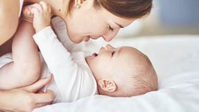 Woman playing with her baby